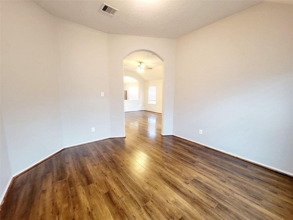 219 Golden Grain Drive Rosenberg, TX 77469 - Photo 10 of 17 a view of a room with wooden floor and window