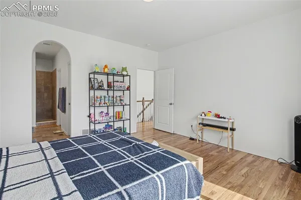 a room with gym equipment and a shower