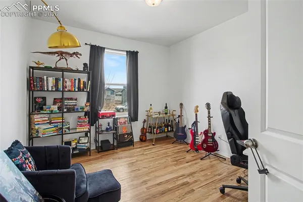 a view of a workspace with furniture and a living room