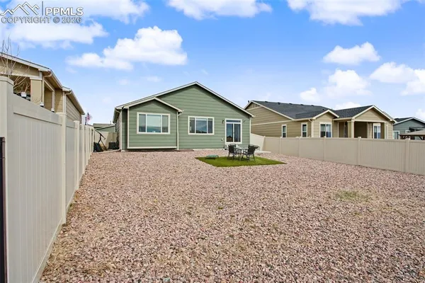 a house with trees in the background