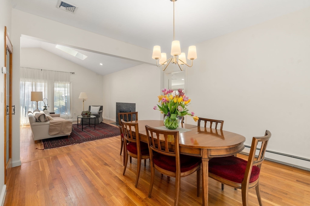 50 Mary Ellen Road Newton, MA 02468 - Photo 4 of 22 a view of a dining room with furniture a chandelier and wooden floor