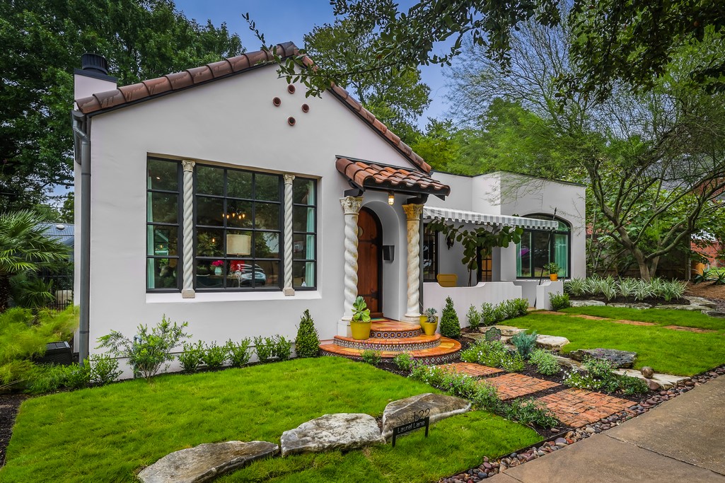 122 Laurel Lane Austin, TX 78705 - Photo 1 of 1 a view of a white house with a yard potted plants and a large tree