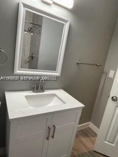 842 Southwest 3rd Street, Unit 844 Miami, FL 33130 - Photo 4 of 11 a bathroom with a sink and a mirror