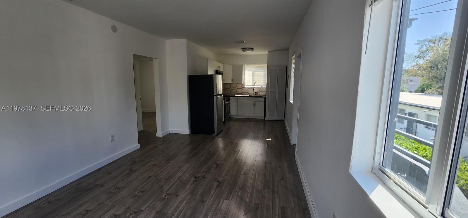842 Southwest 3rd Street, Unit 844 Miami, FL 33130 - Photo 6 of 11 a view of hallway with wooden floor and electronic appliances
