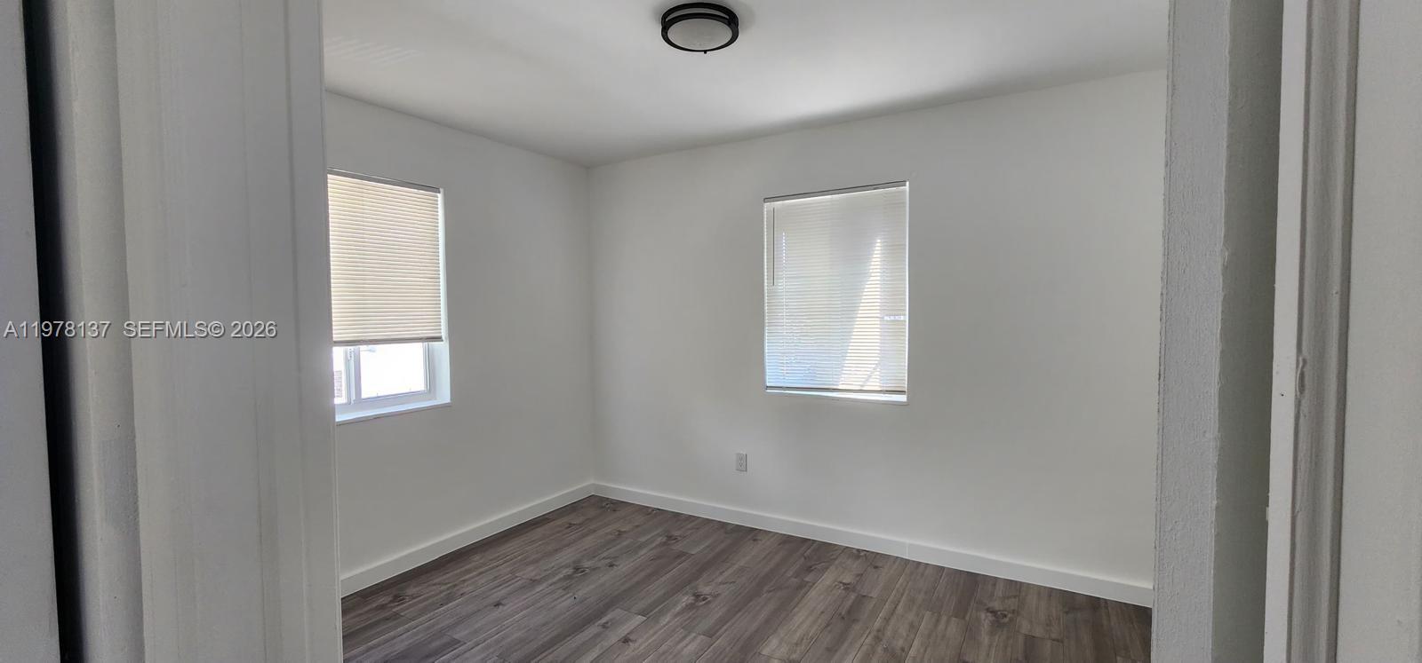 842 Southwest 3rd Street, Unit 844 Miami, FL 33130 - Photo 10 of 11 a view of empty room with wooden floor