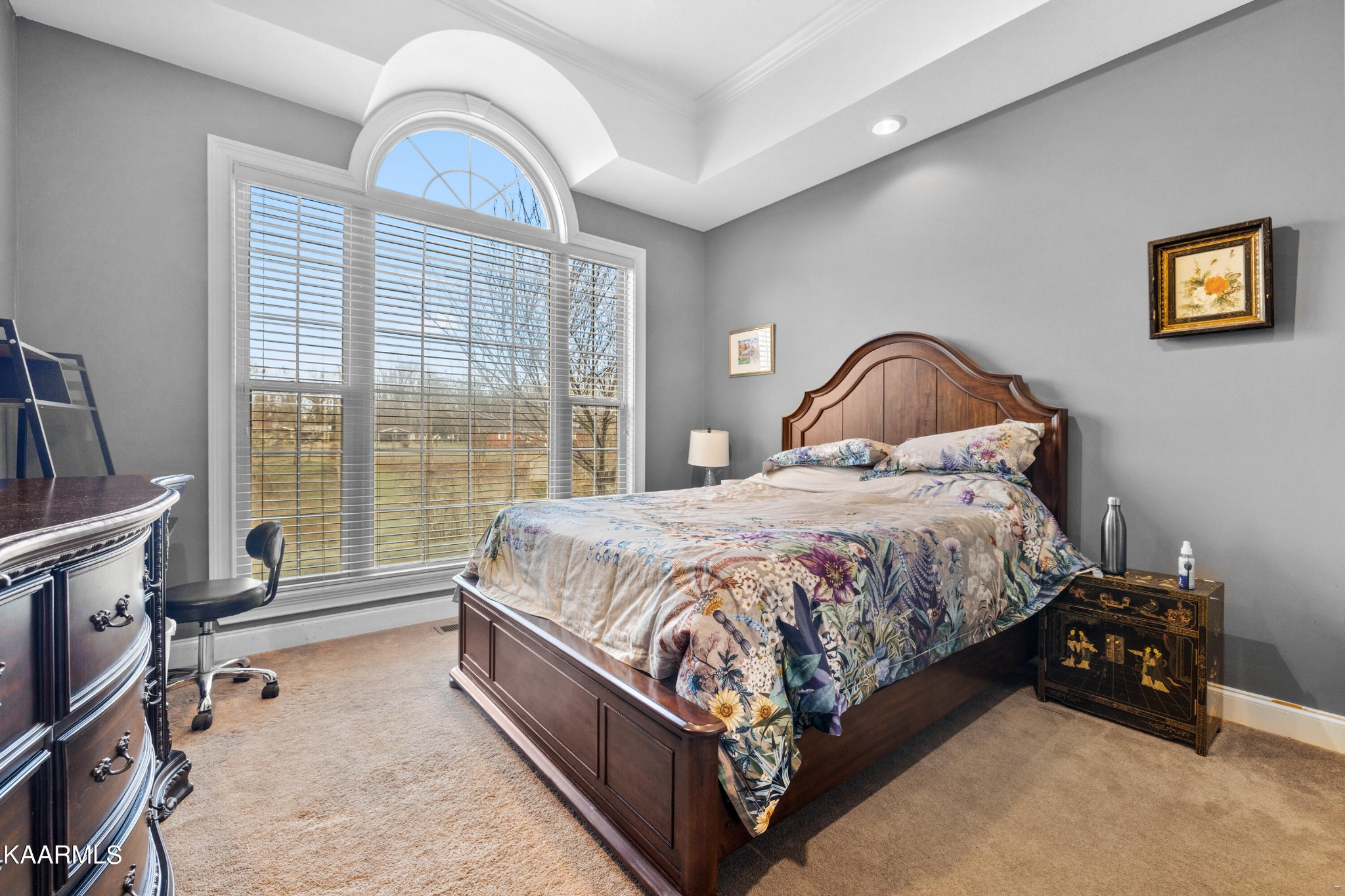 1142 Denton Road Sevierville, TN 37862 - Photo 18 of 28 a spacious bedroom with a bed a dresser with wooden floor