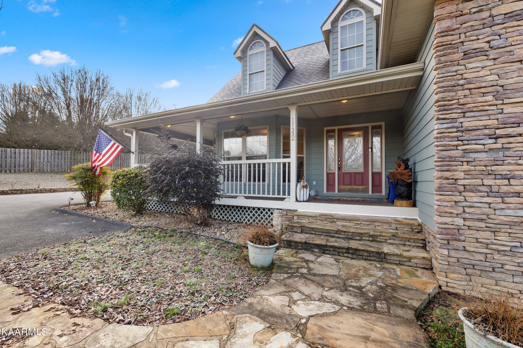 1142 Denton Road Sevierville, TN 37862 - Photo 2 of 28 a view of a house with backyard and porch