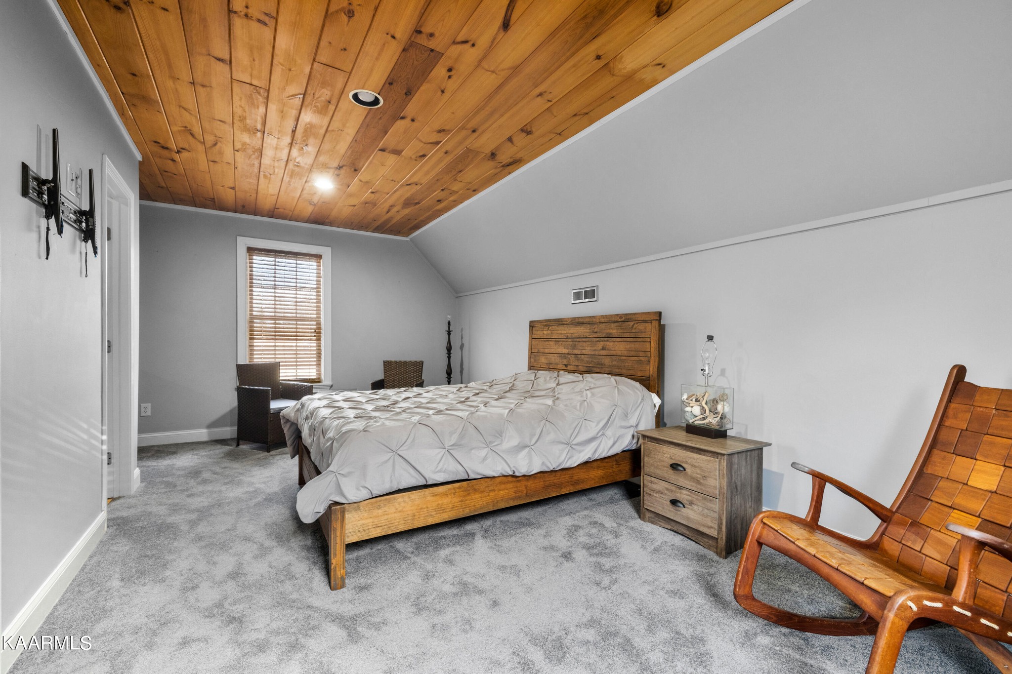 1142 Denton Road Sevierville, TN 37862 - Photo 21 of 28 a bedroom with a bed and chair