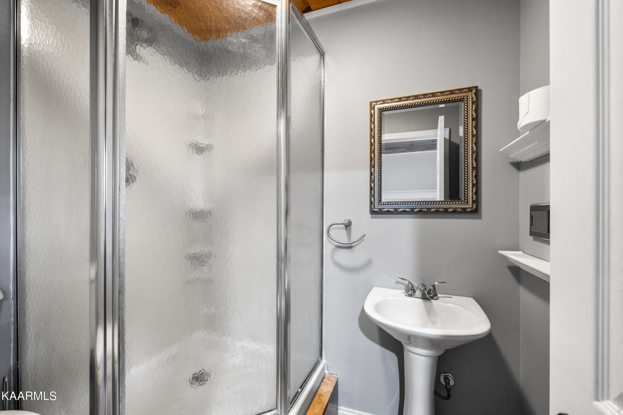 1142 Denton Road Sevierville, TN 37862 - Photo 23 of 28 a bathroom with a sink mirror toilet and shower