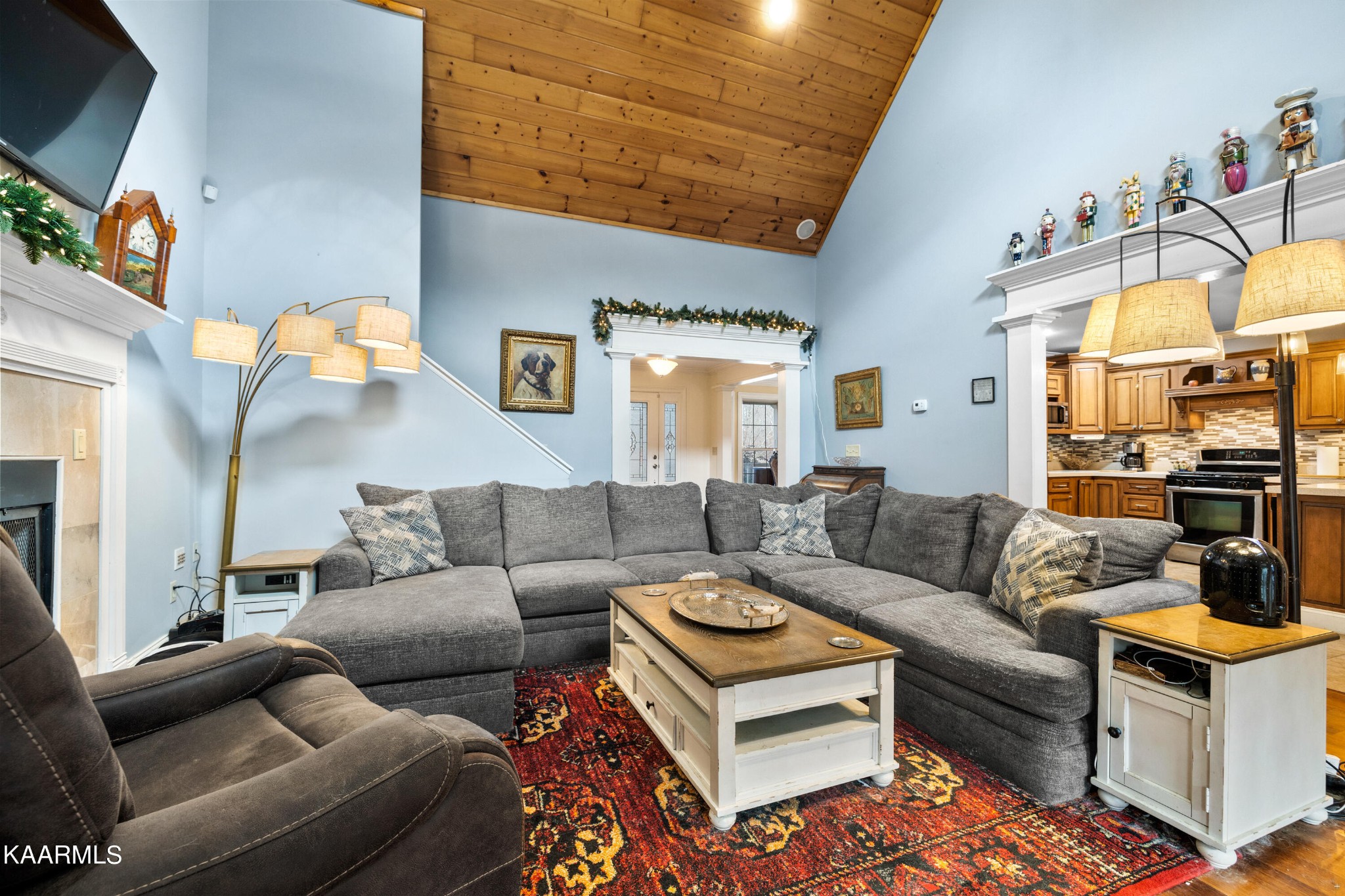 1142 Denton Road Sevierville, TN 37862 - Photo 3 of 28 a living room with furniture a rug and a chandelier