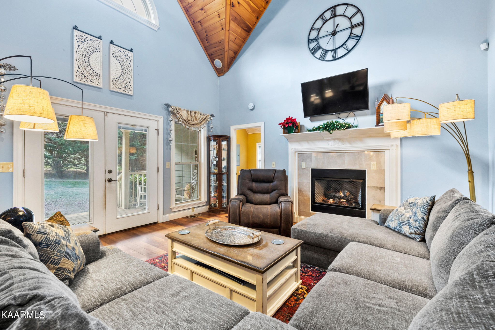 1142 Denton Road Sevierville, TN 37862 - Photo 6 of 28 a living room with furniture a flat screen tv and a fireplace