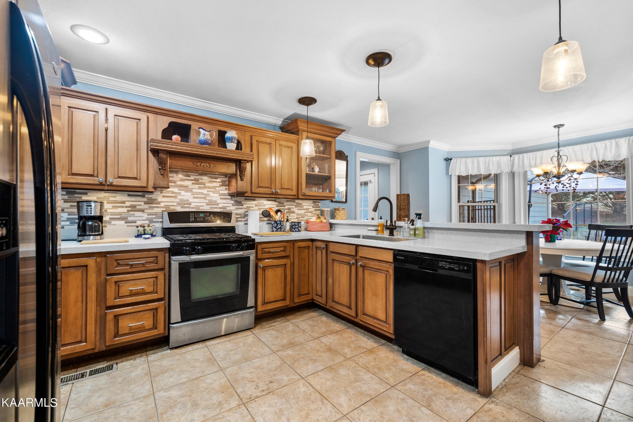 1142 Denton Road Sevierville, TN 37862 - Photo 8 of 28 a kitchen with stainless steel appliances granite countertop a stove and a sink