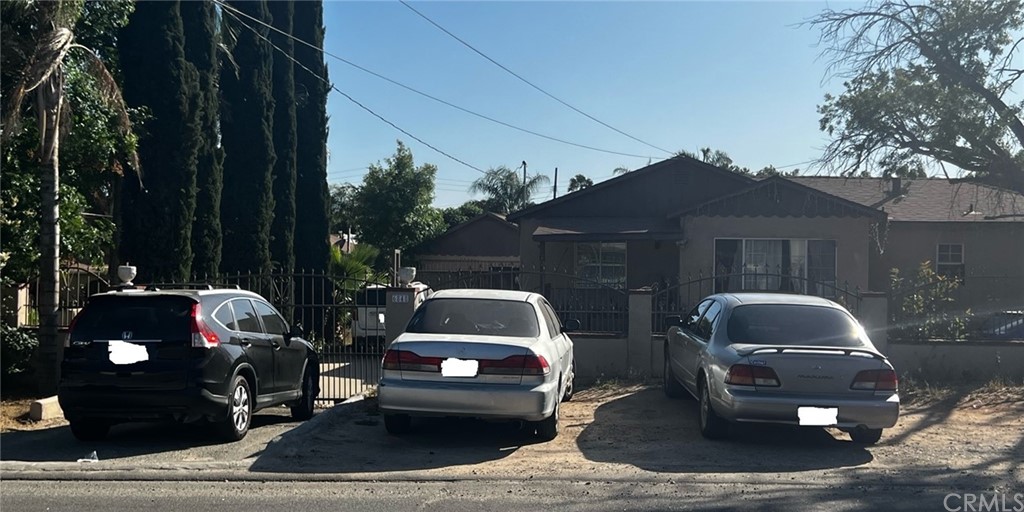 6848 36th Street Riverside, CA 92509 - Photo 1 of 1 a front view of a house with parking space