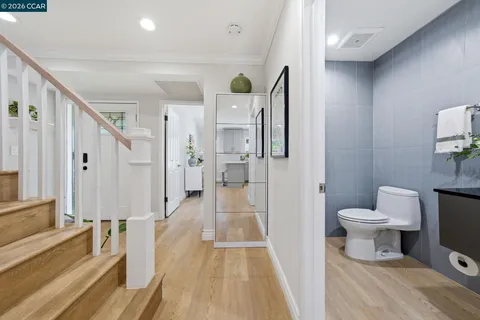 a kitchen with stainless steel appliances a refrigerator sink and cabinets