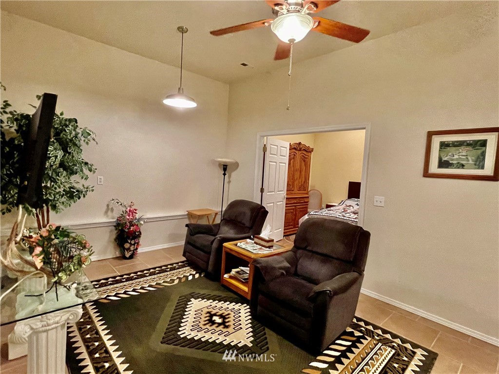 19229 Patterson Road East Orting, WA 98360 - Photo 25 of 35 a living room with furniture and a chandelier