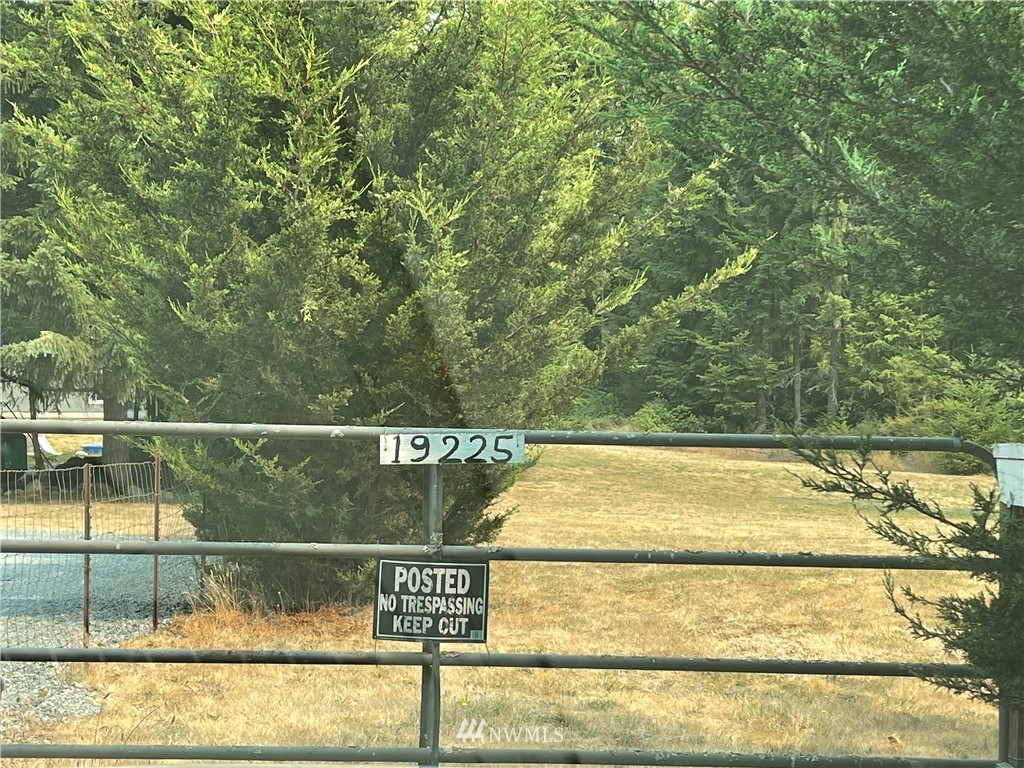 19229 Patterson Road East Orting, WA 98360 - Photo 35 of 35 a view of a swimming pool with a bench and large trees