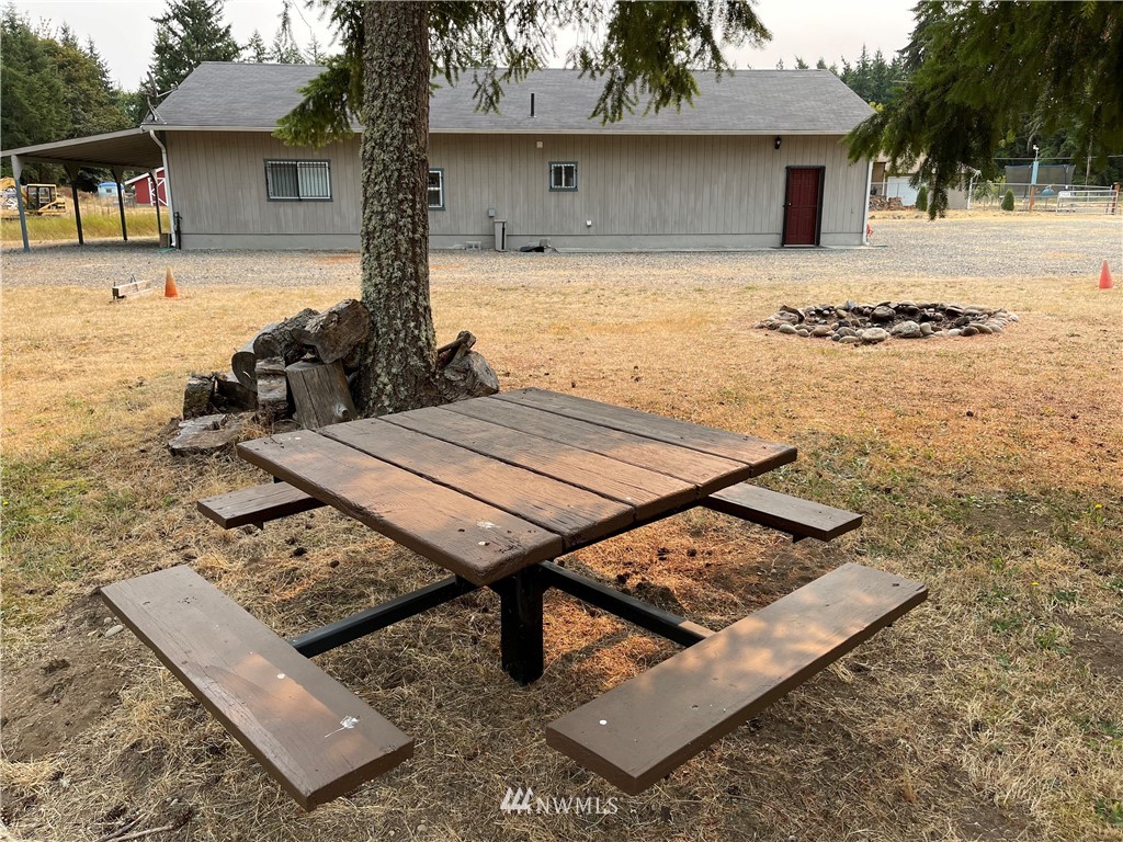 19229 Patterson Road East Orting, WA 98360 - Photo 7 of 35 a view of a dinning table and chair in the patio
