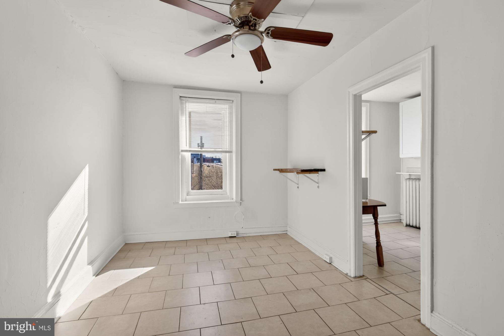 a view of an empty room and window