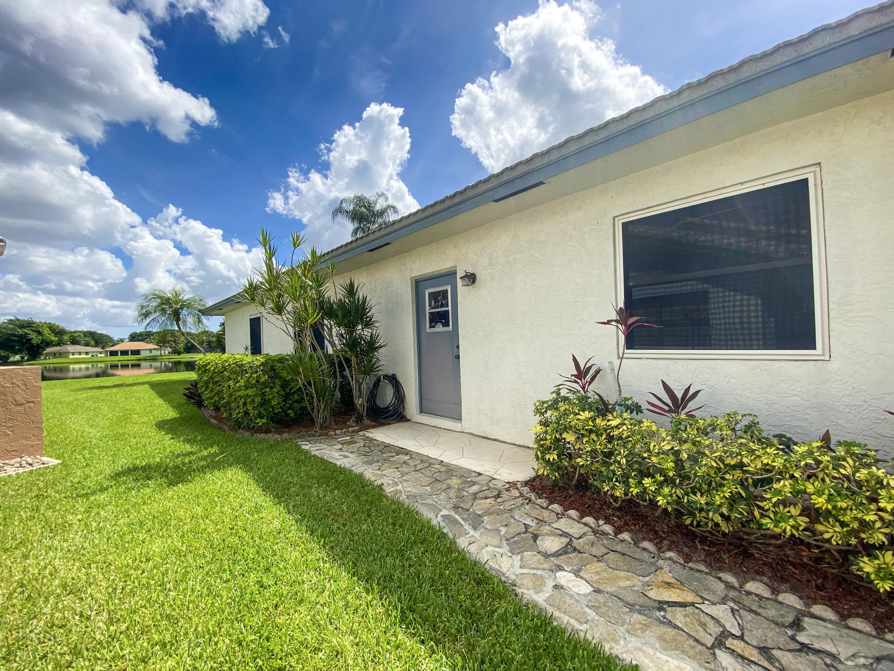 86 Las Brisas Boynton Beach, FL 33426 - Photo 30 of 37 Side Door to Garage!