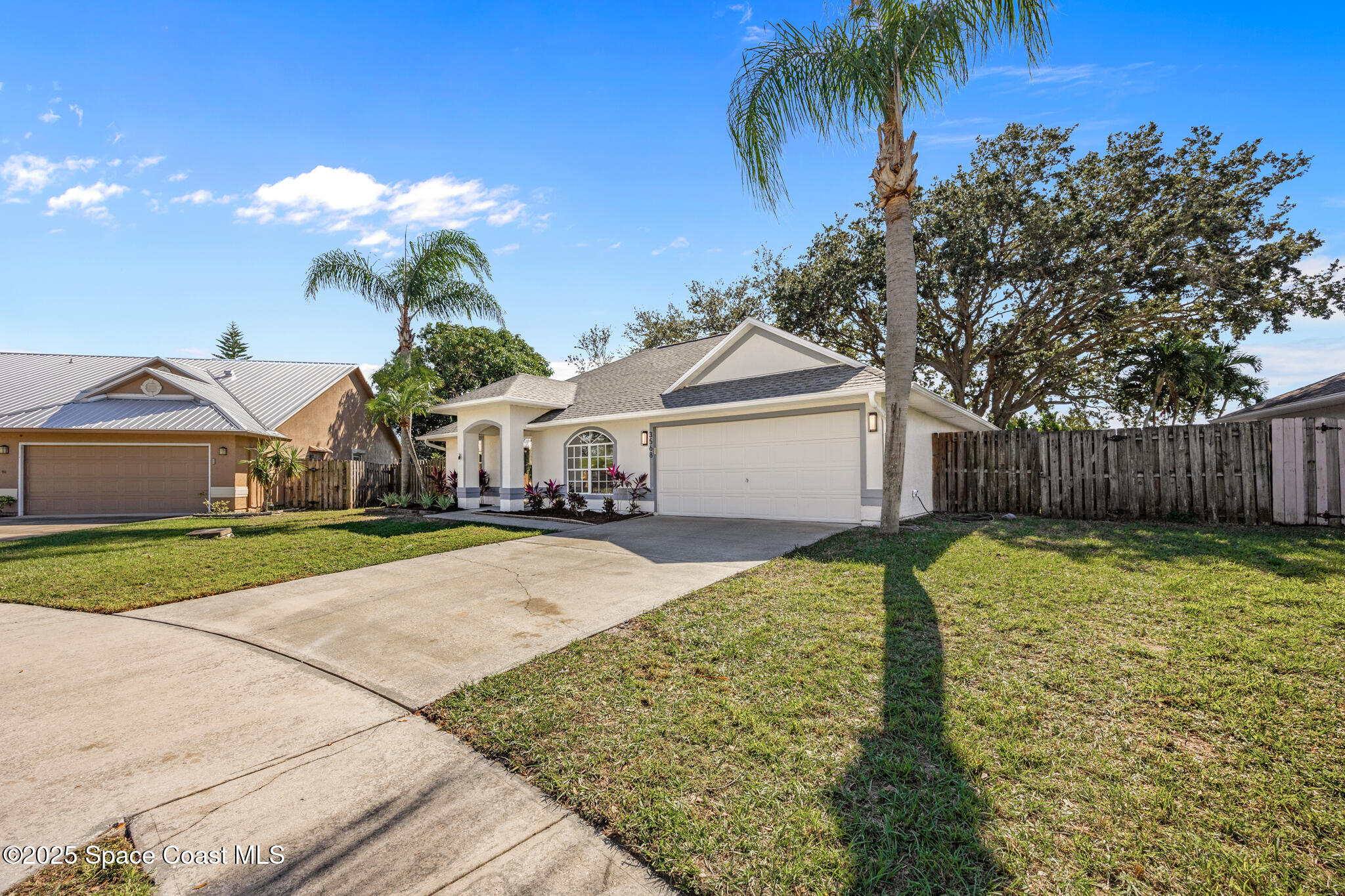 3568 Egret Drive Melbourne, FL 32901 - Photo 22 of 27 a front view of a house with garden