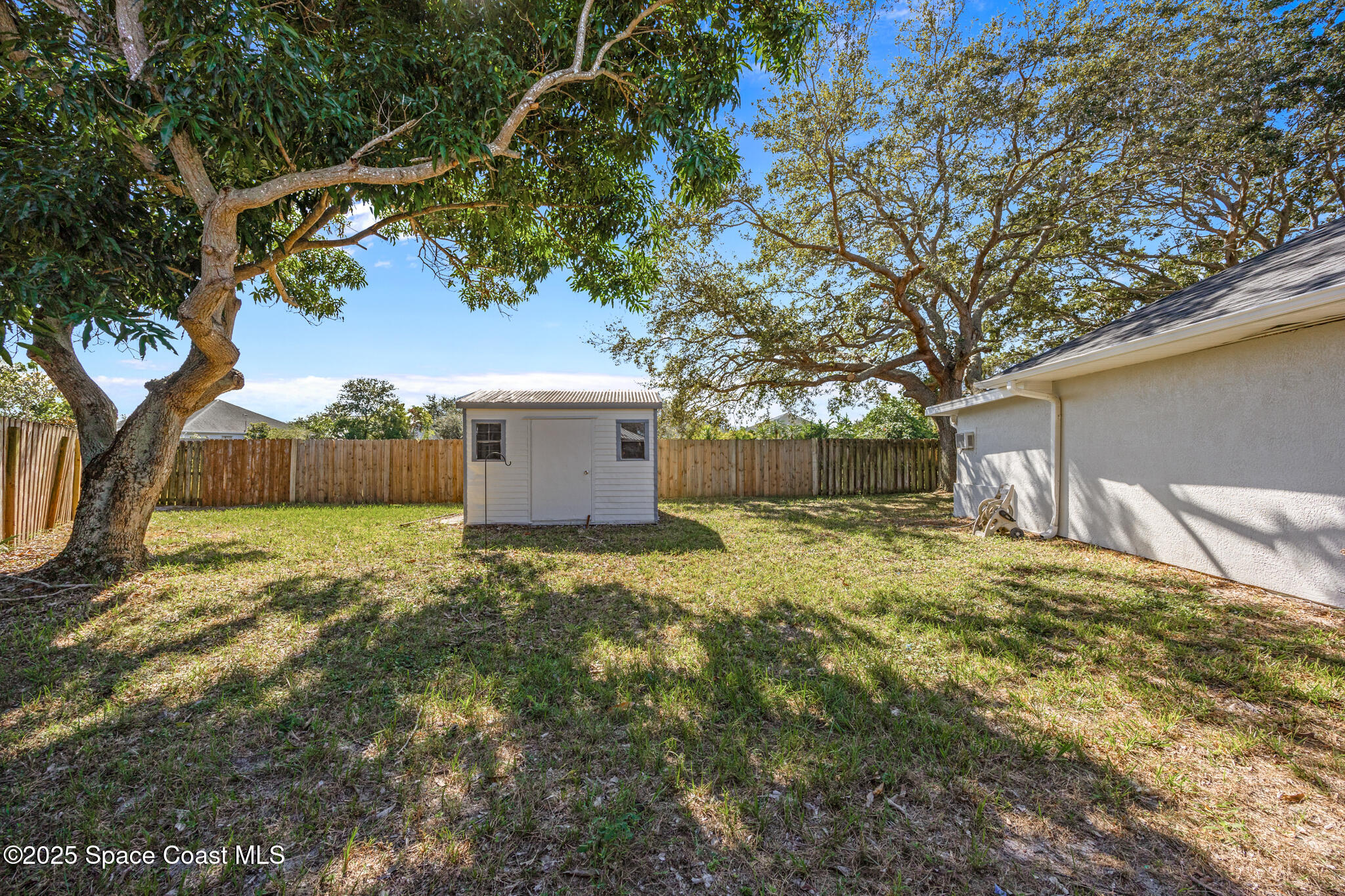 3568 Egret Drive Melbourne, FL 32901 - Photo 24 of 27 a backyard of a house