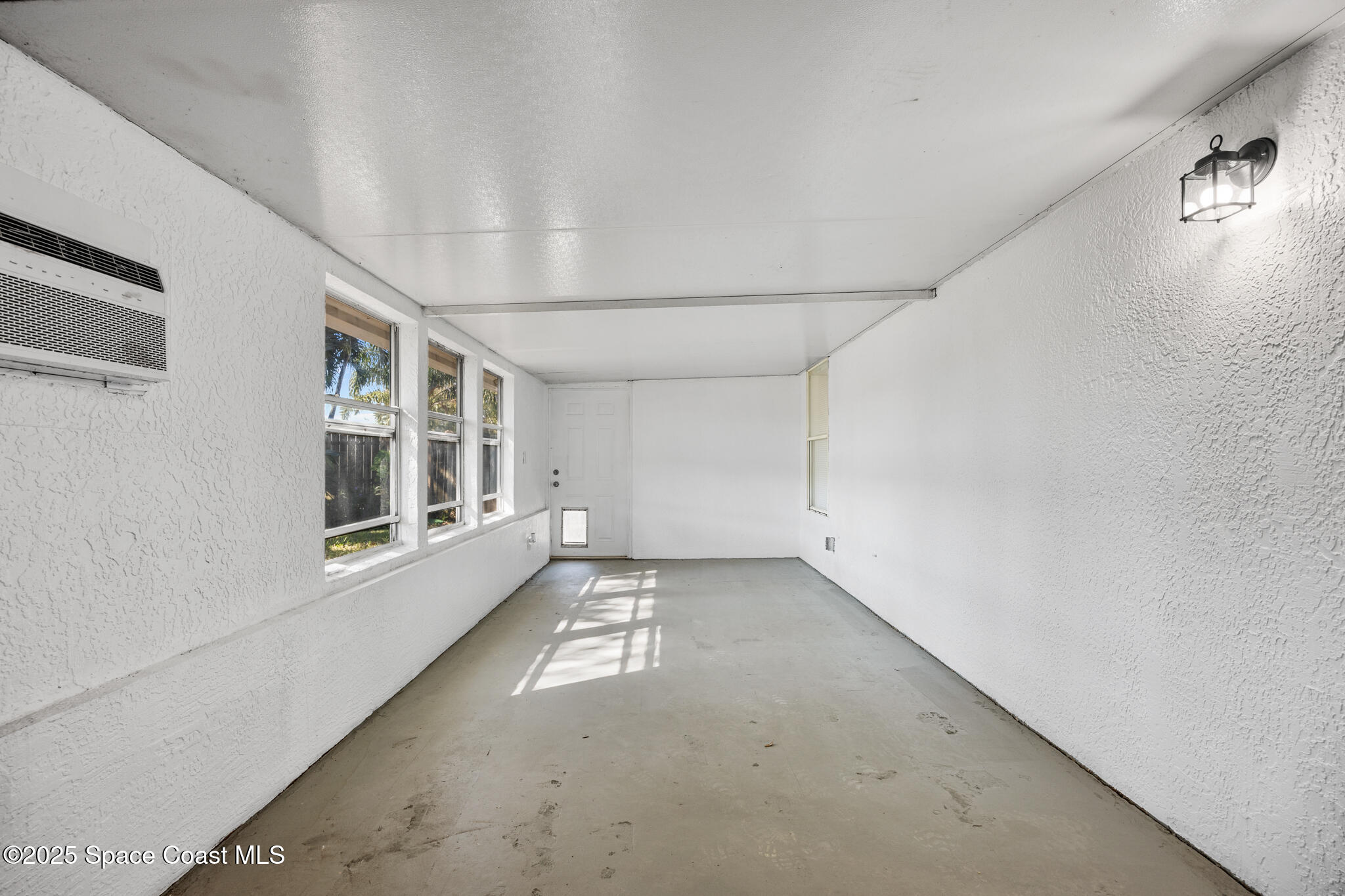 3568 Egret Drive Melbourne, FL 32901 - Photo 25 of 27 a view of an empty room with a window
