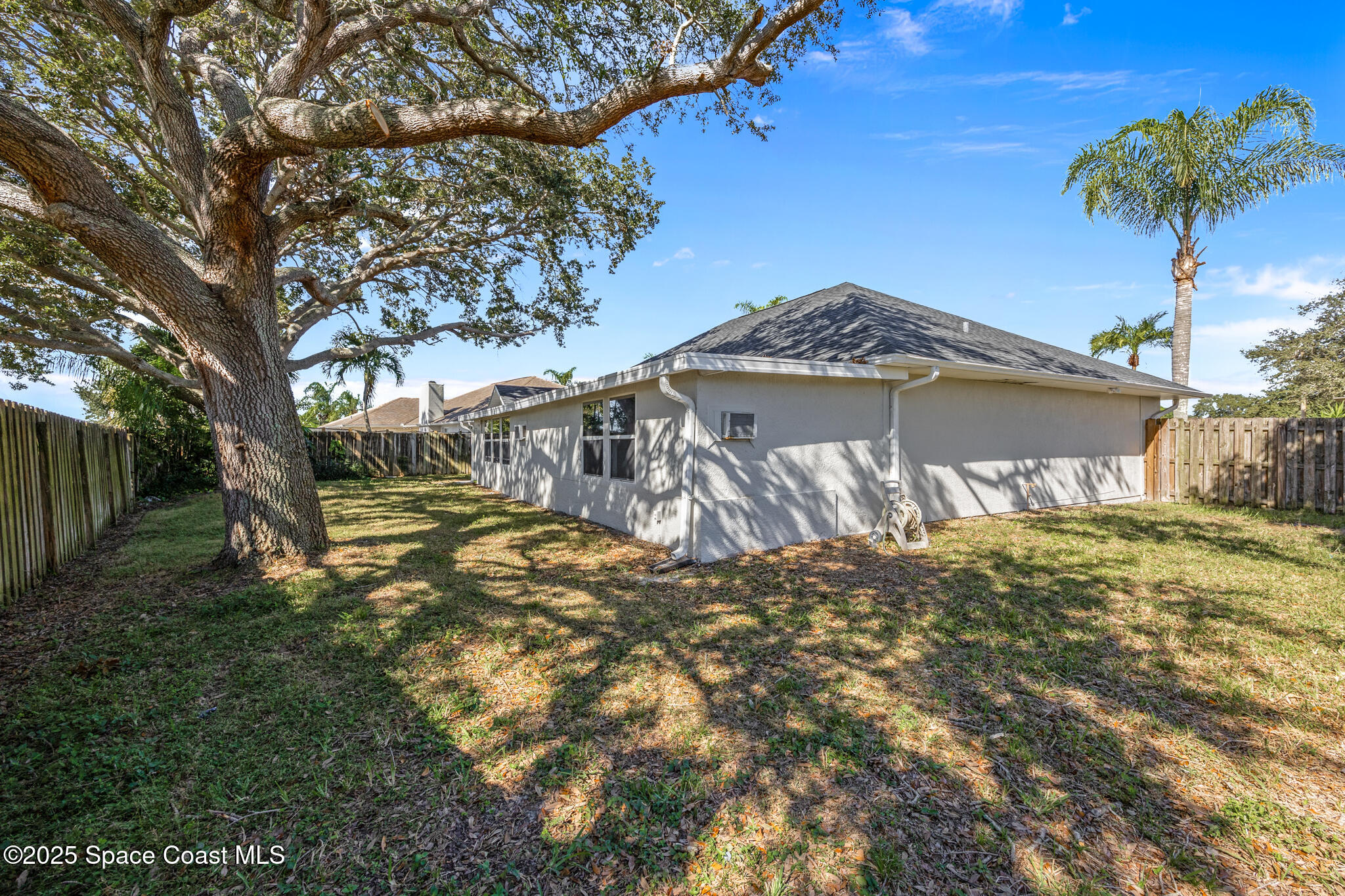 3568 Egret Drive Melbourne, FL 32901 - Photo 26 of 27 a view of a house with a yard
