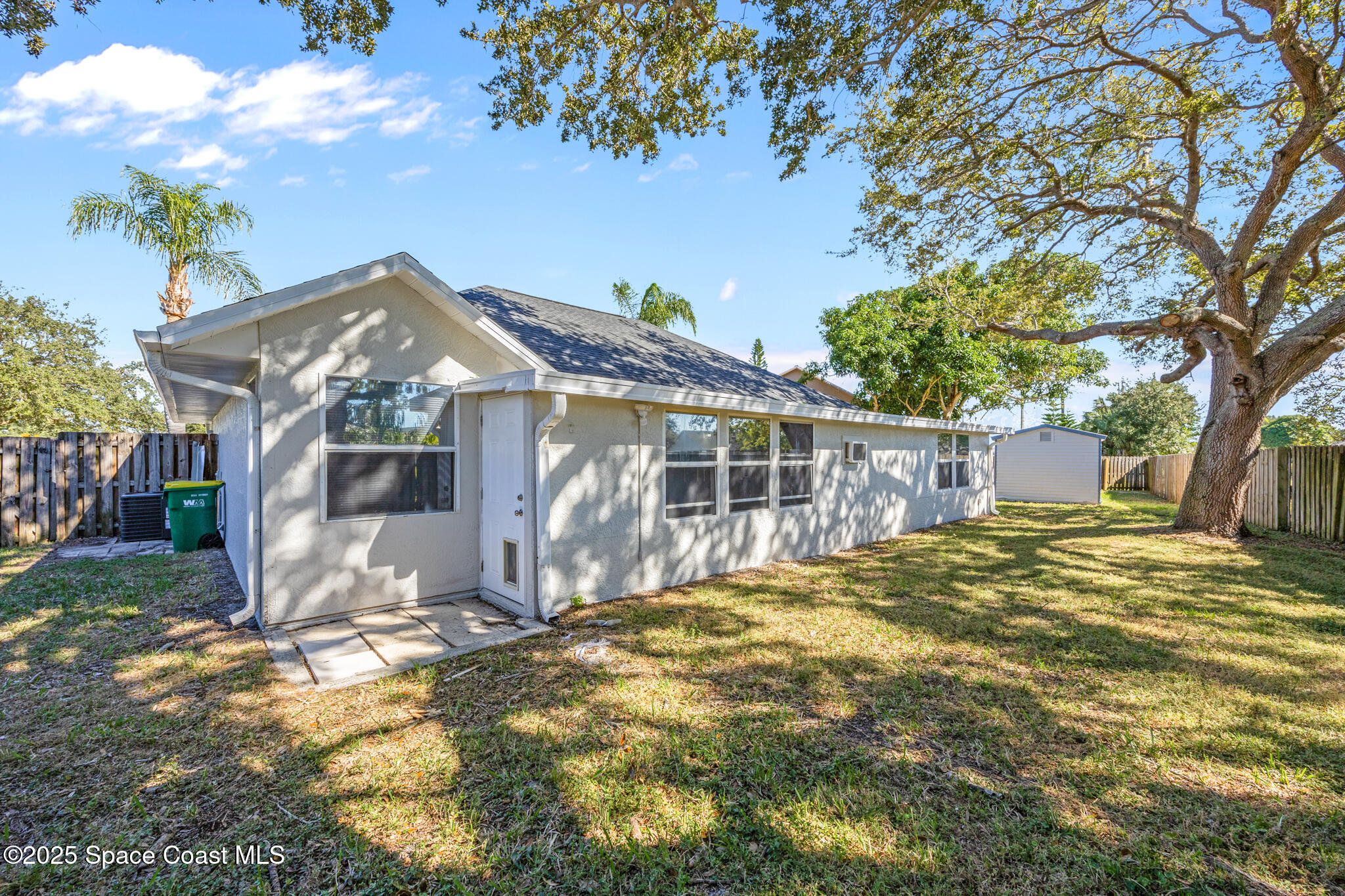 3568 Egret Drive Melbourne, FL 32901 - Photo 2 of 27 a front view of a house with a yard