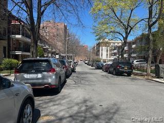 83-52 Talbot Street, Unit 3J Queens, NY 11415 - Photo 2 of 50 a view of street with parked cars