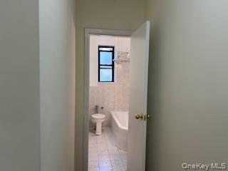 83-52 Talbot Street, Unit 3J Queens, NY 11415 - Photo 29 of 50 a bathroom with a toilet