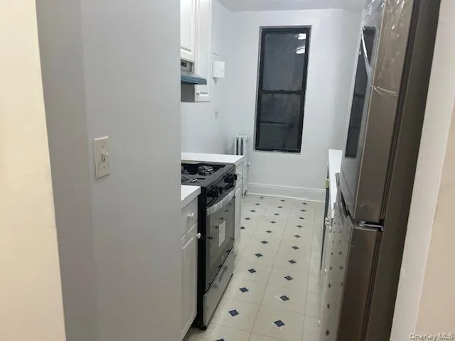 a bathroom with a shower and a sink