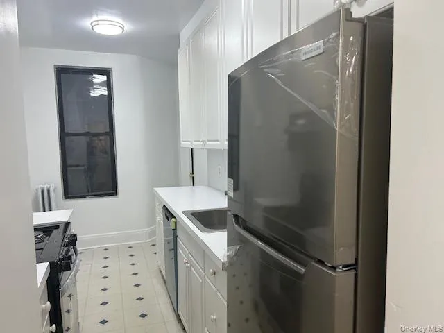 a bathroom with a shower sink and mirror