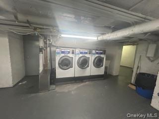 83-52 Talbot Street, Unit 3J Queens, NY 11415 - Photo 43 of 50 a utility room with dryer and washer