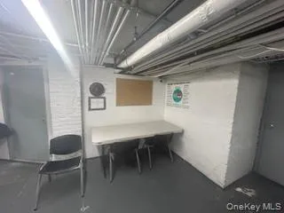 a view of a hallway with seating area