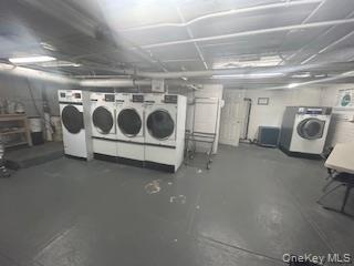 83-52 Talbot Street, Unit 3J Queens, NY 11415 - Photo 45 of 50 a utility room with stainless steel appliances granite countertop a stove and a refrigerator