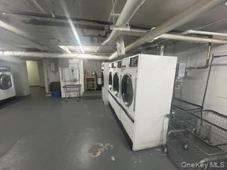 83-52 Talbot Street, Unit 3J Queens, NY 11415 - Photo 47 of 50 a utility room with dryer and washer