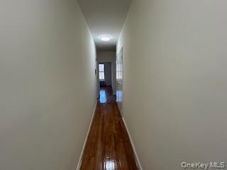 83-52 Talbot Street, Unit 3J Queens, NY 11415 - Photo 8 of 50 a view of a hallway with wooden floor