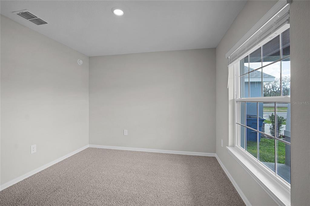 1617 Astrid Road Davenport, FL 33837 - Photo 11 of 43 a view of an empty room with a window