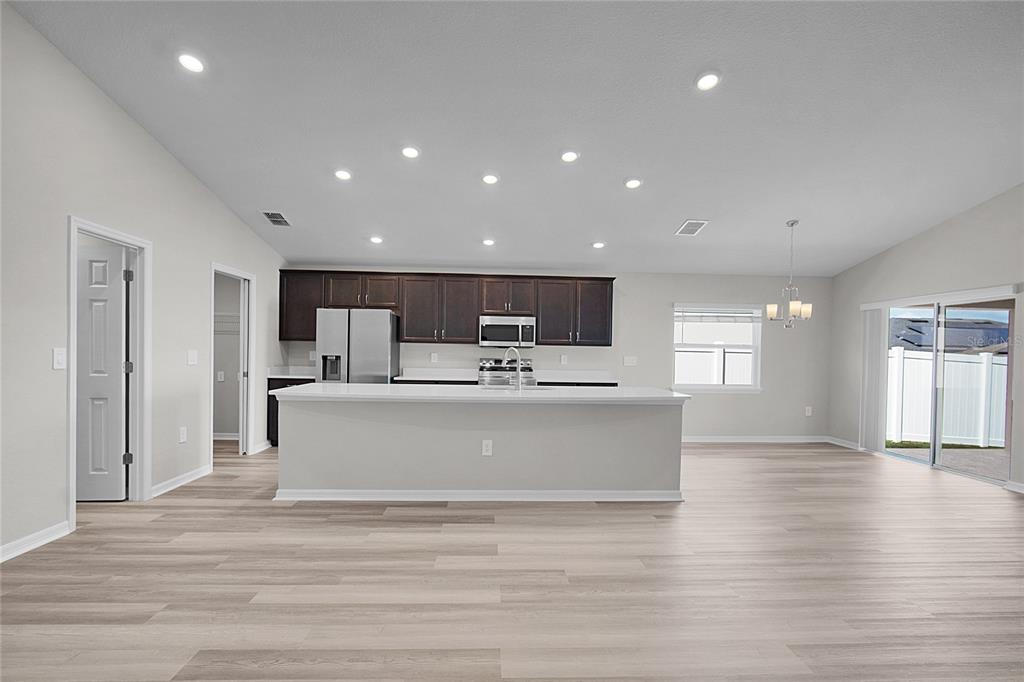 1617 Astrid Road Davenport, FL 33837 - Photo 17 of 43 a view of kitchen with cabinets microwave and refrigerator