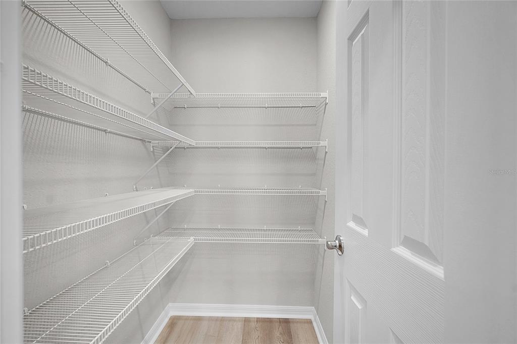 1617 Astrid Road Davenport, FL 33837 - Photo 23 of 43 a view of walk in closet with empty racks