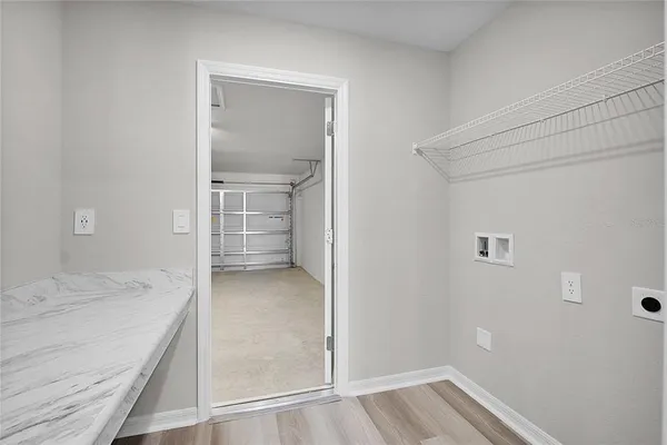 a view of livingroom with window and hardwood floor