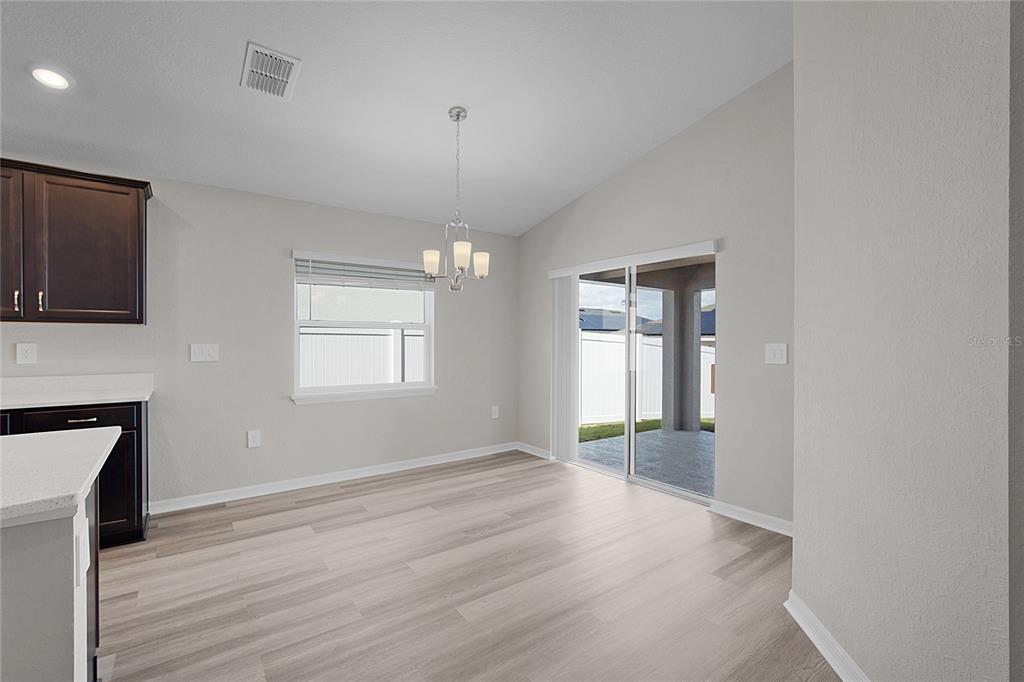 1617 Astrid Road Davenport, FL 33837 - Photo 25 of 43 a view of livingroom with window and hardwood floor