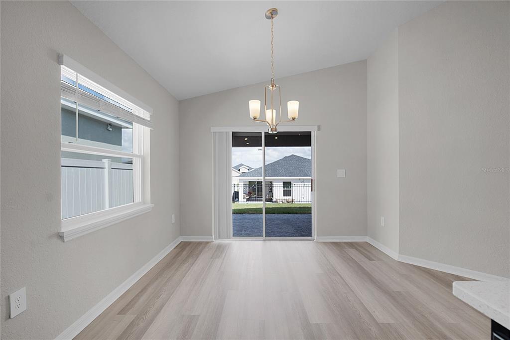 1617 Astrid Road Davenport, FL 33837 - Photo 26 of 43 a view of a kitchen and an empty room