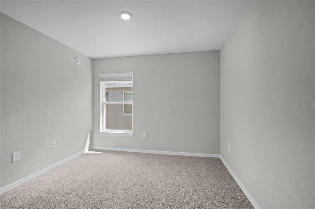 1617 Astrid Road Davenport, FL 33837 - Photo 27 of 43 a view of an empty room with a window