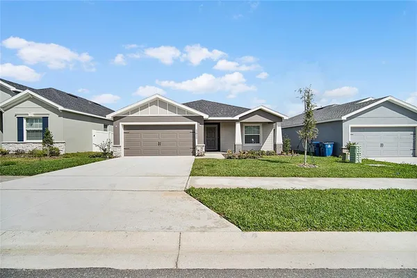 a view of house with a garden