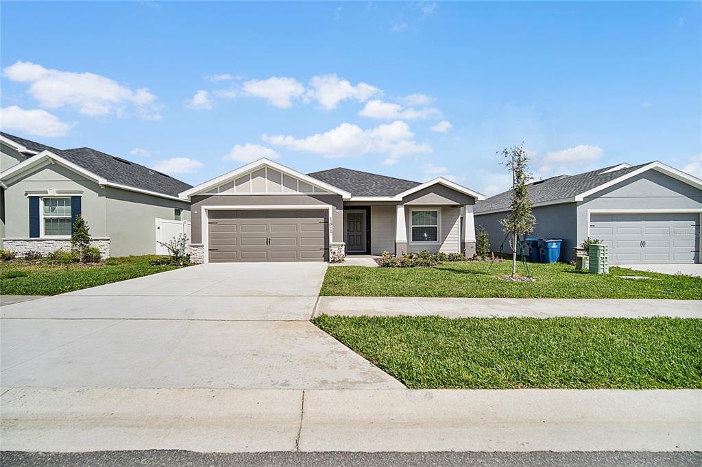1617 Astrid Road Davenport, FL 33837 - Photo 3 of 43 a view of house with a garden