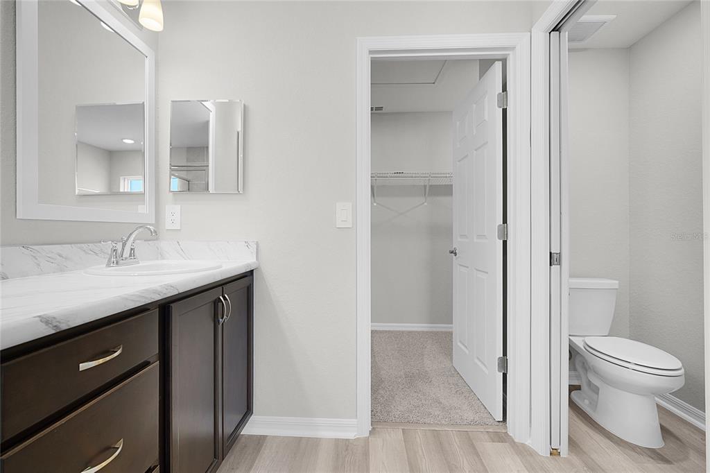 1617 Astrid Road Davenport, FL 33837 - Photo 33 of 43 a bathroom with a sink a toilet and shower