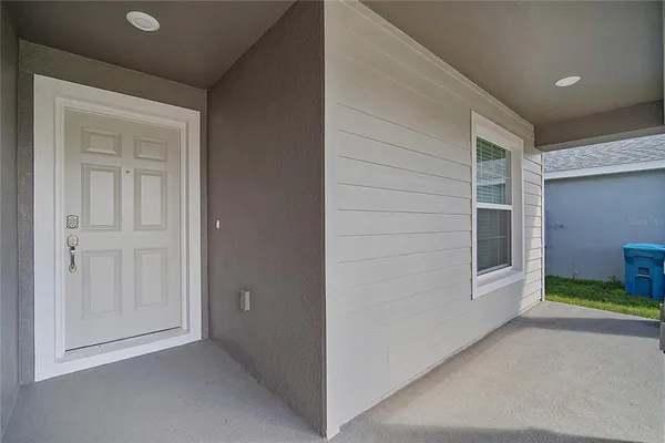 a view of swimming pool with a patio