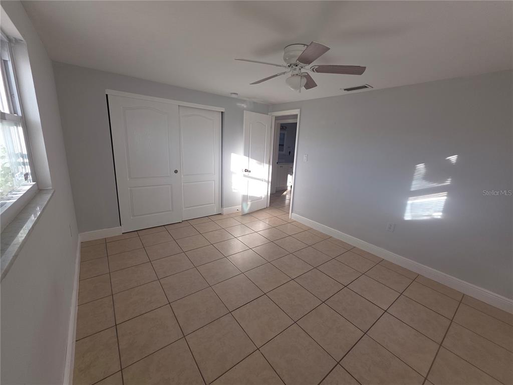1344 Wickham Lane Holiday, FL 34691 - Photo 13 of 17 a view of an empty room and window