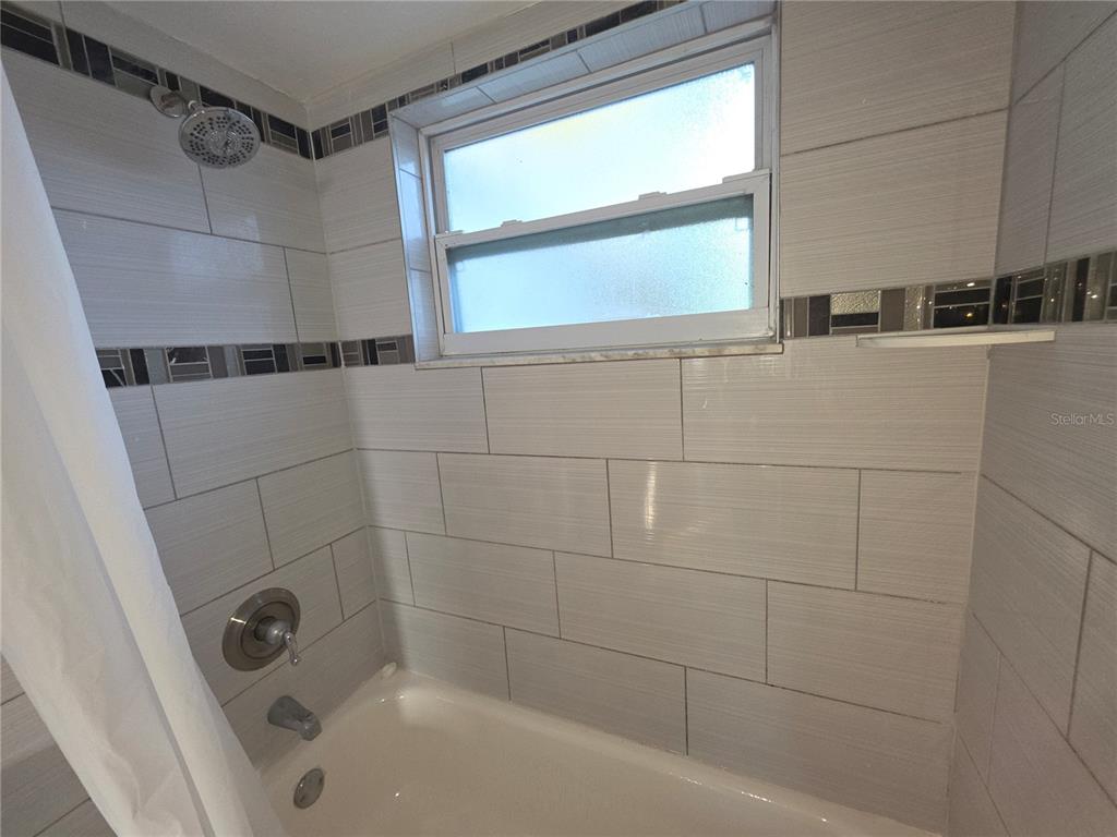 1344 Wickham Lane Holiday, FL 34691 - Photo 16 of 17 a bathroom with a bathtub